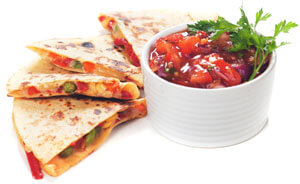 Quesadilla and a white bowl of salsa.