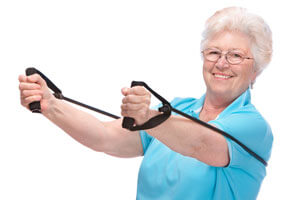 elderly woman using exercise bands