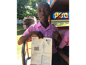 haiti boy with book 