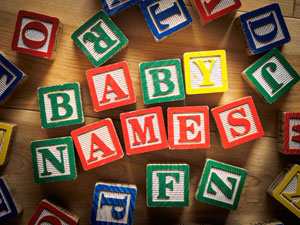 Wooden letter blocks that spell out "Baby Names".