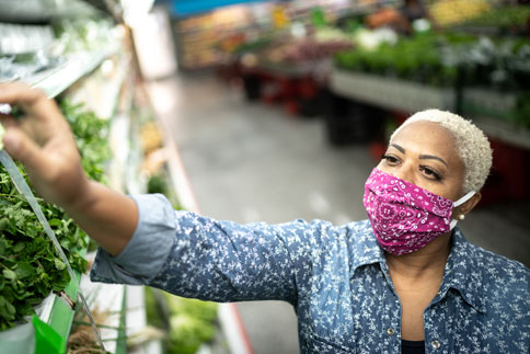 Woman shopping while wearing a mask