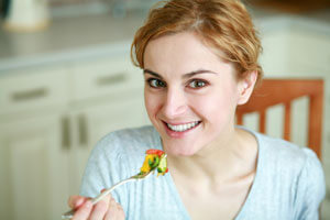woman eating colorful food