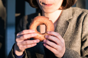 person holding donut