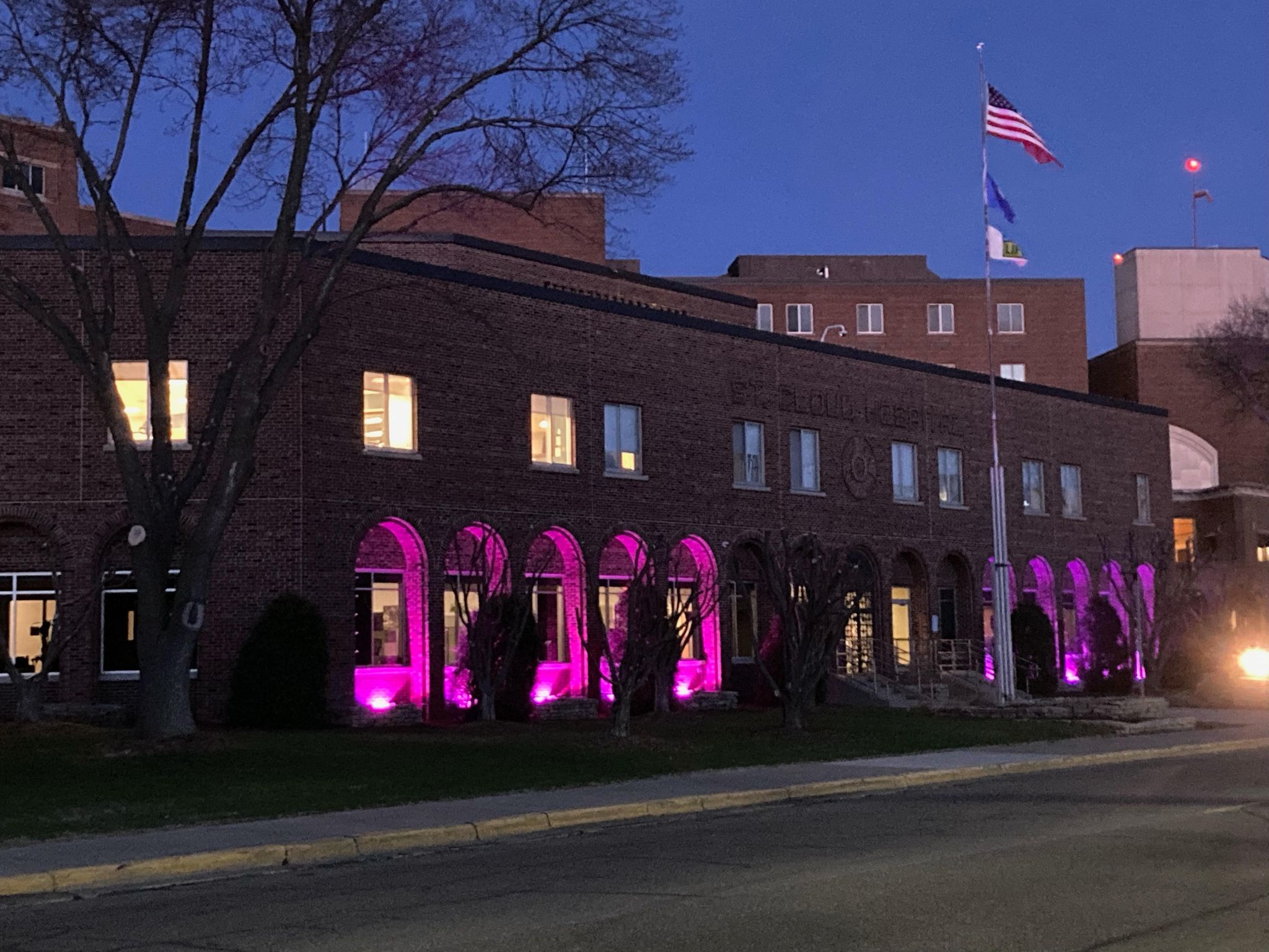 Photo of CentraCare – St. Cloud Hospital is lit up in purple lights for Stroke Awareness Month.