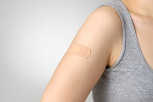 Band-aid on the arm of patient