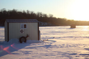 fishing house on frozen lake