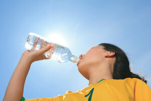 soccer player drinking water