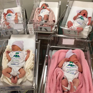 Five infants in a nursery